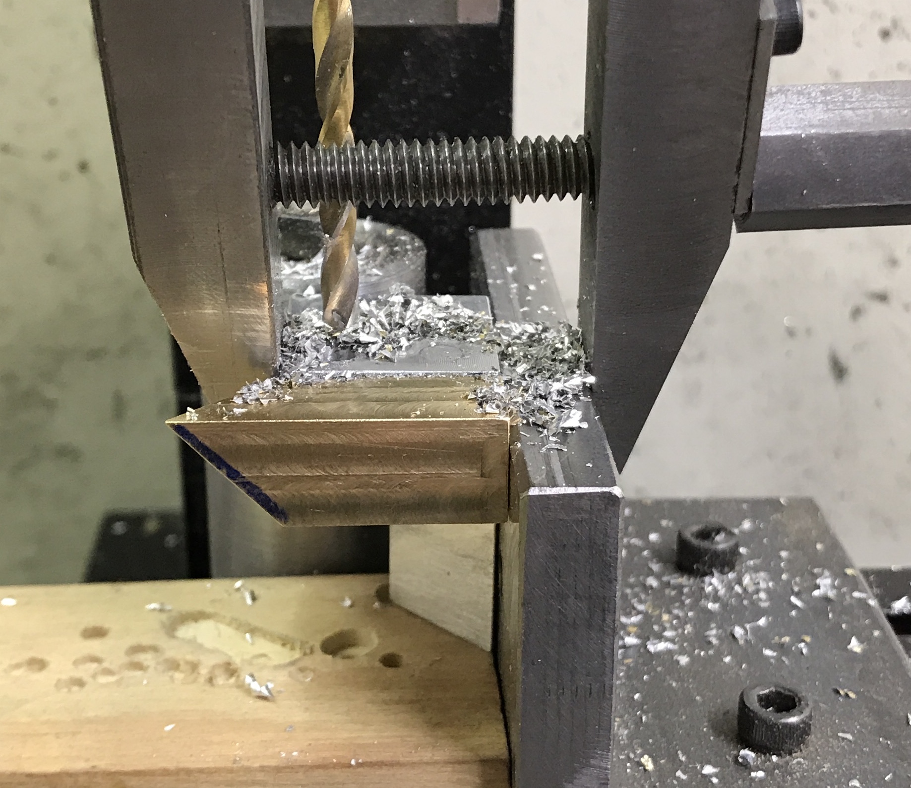 The setup for drilling the wood and aluminum